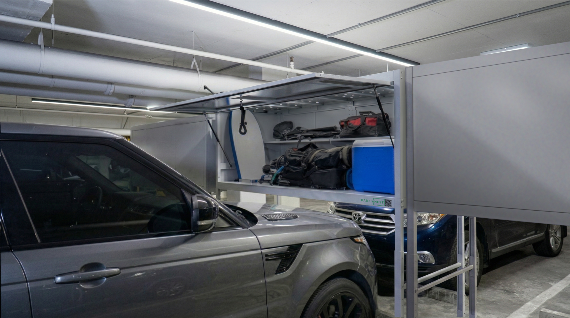 Park'ɴNest lockers installed above parked vehicles in a residential garage